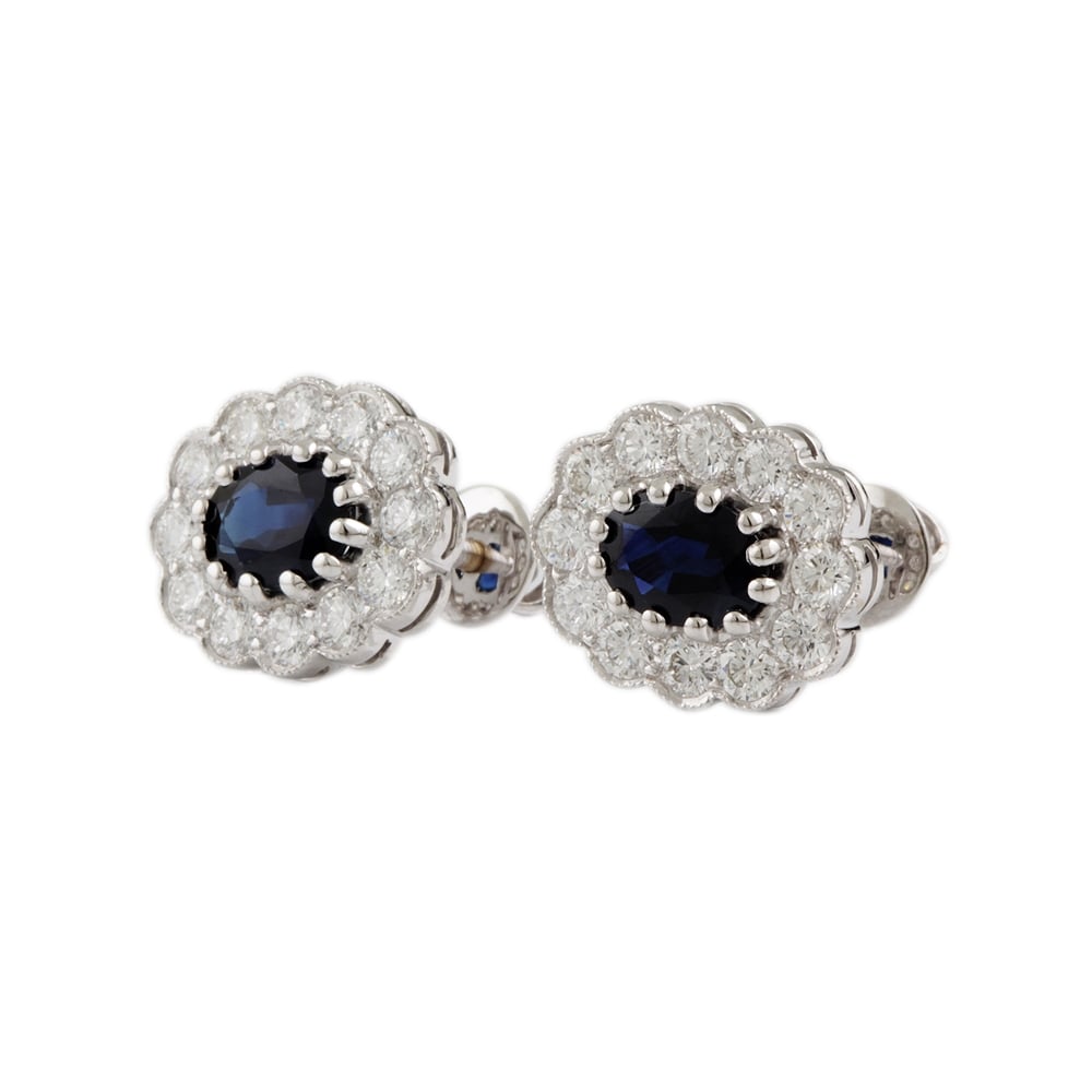 9ct white gold Sapphire and diamond cluster earrings.