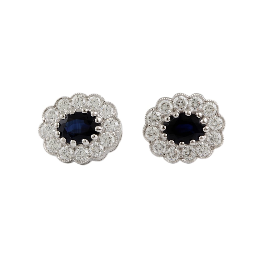 9ct white gold Sapphire and diamond cluster earrings.