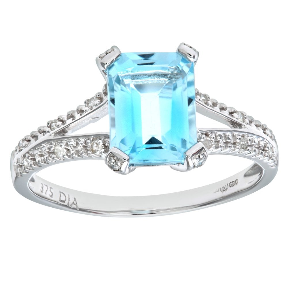 SPARKLD 9ct White Gold Emerald Cut Blue Topaz Ring with 0.07ct Diamond Shoulders