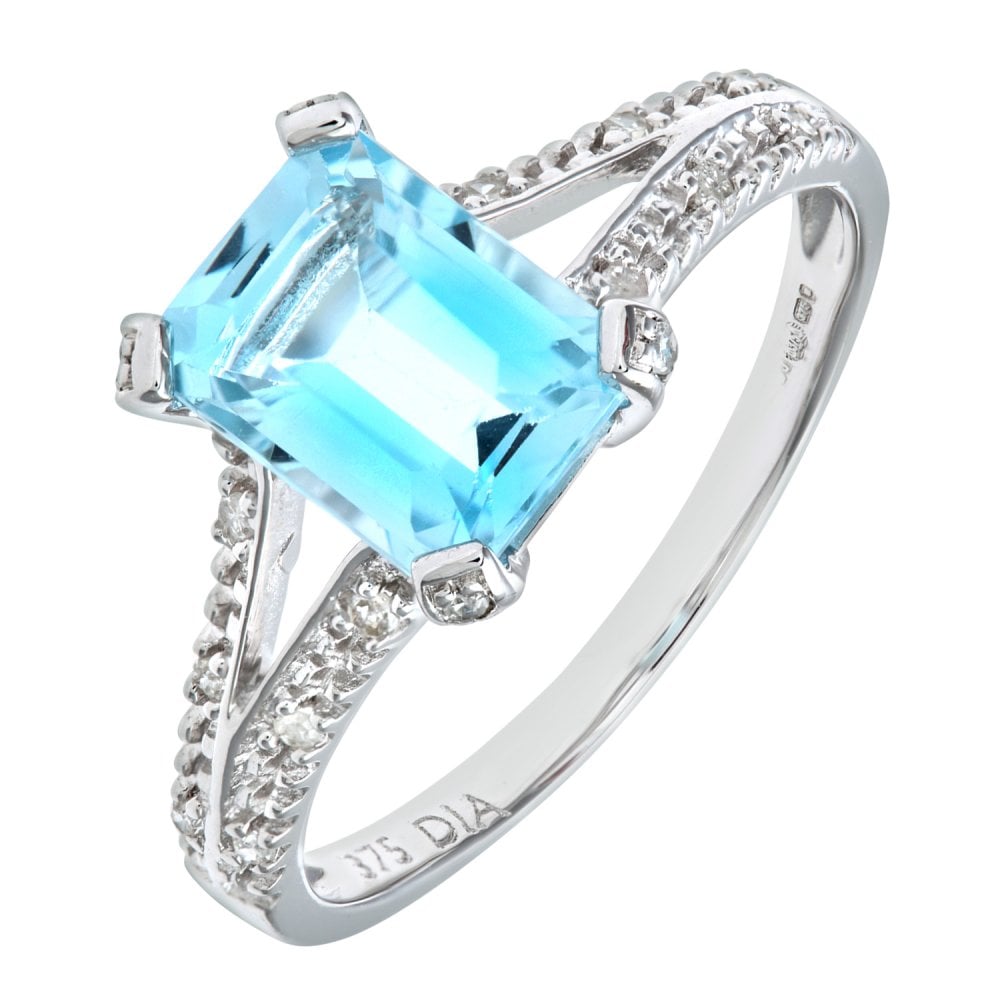 SPARKLD 9ct White Gold Emerald Cut Blue Topaz Ring with 0.07ct Diamond Shoulders