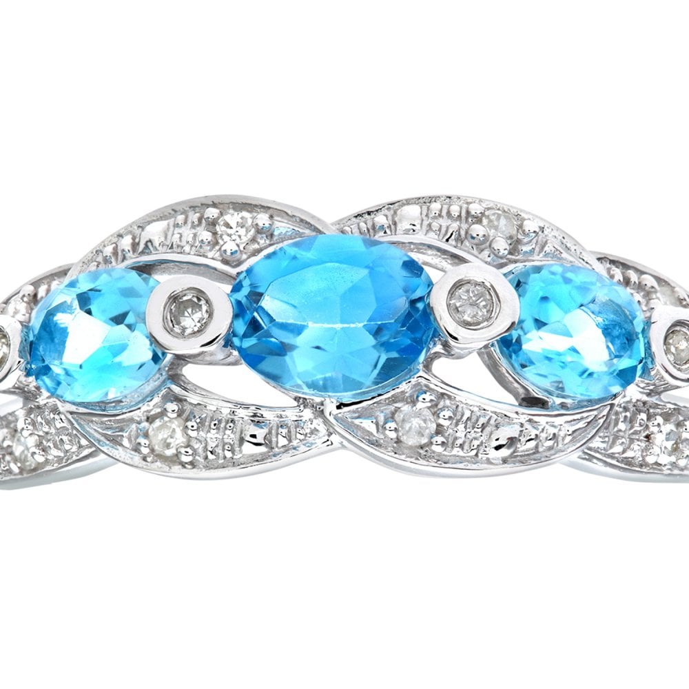 SPARKLD 9ct White Gold Blue Topaz and 0.05ct Diamond Fig Eight Design Ring