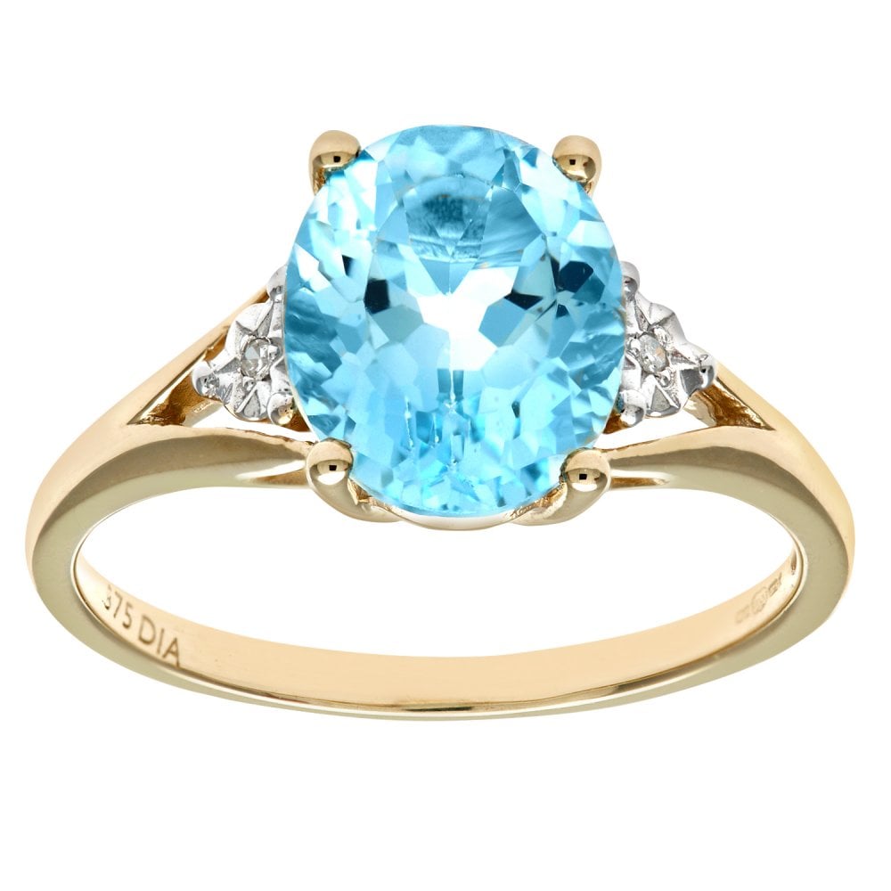 SPARKLD 9ct Yellow Gold Round Brilliant Cut Oval Blue Topaz and 0.01ct Diamond Ring