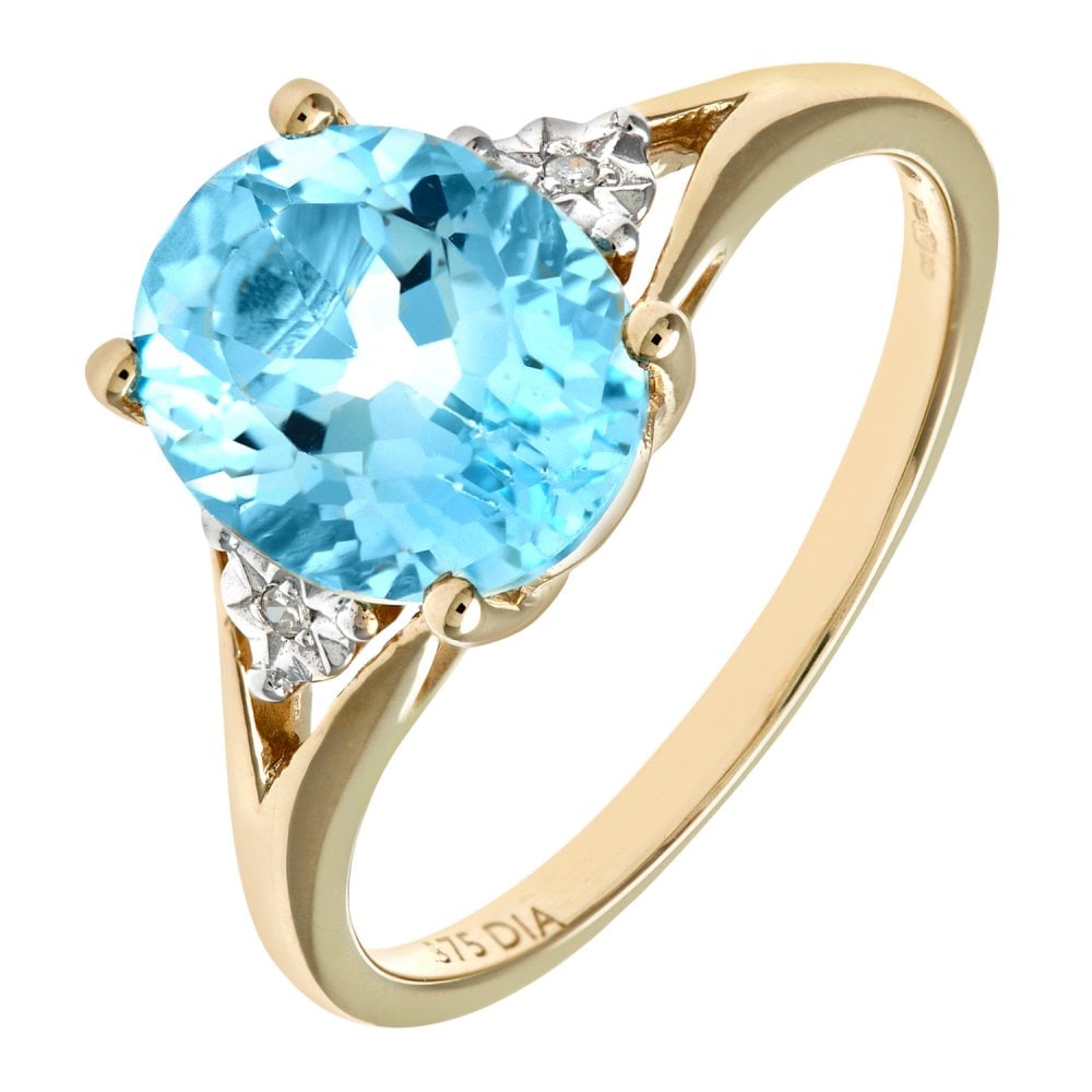 SPARKLD 9ct Yellow Gold Round Brilliant Cut Oval Blue Topaz and 0.01ct Diamond Ring