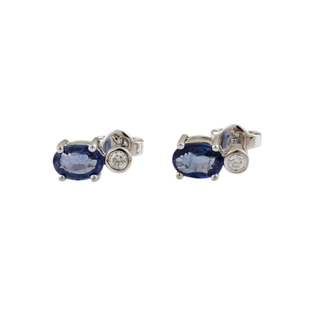 White Gold 0.10ct Round Brilliant Cut Diamond and 1.62ct Oval Blue Sapphire Two Stone Drop Earrings