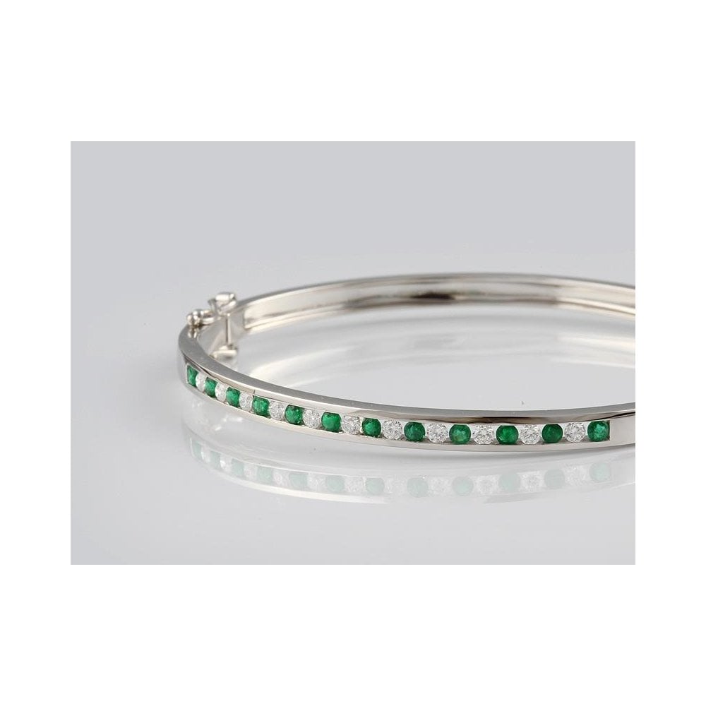 Platinum Channel Set Oval Hinged Emerald 0.64ct And Diamond 0.55ct Bangle With Figure Of Eight Safety Clasps