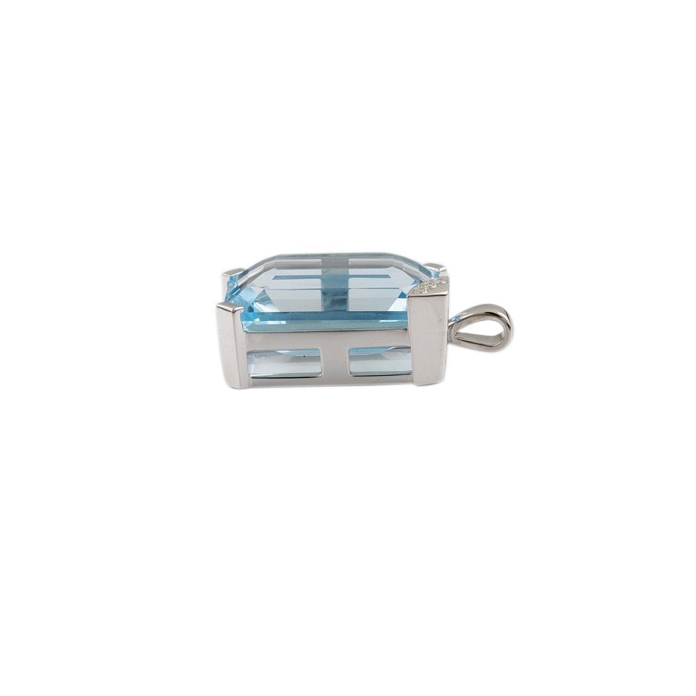 9ct White Gold 0.10ct Round Brilliant Cut Diamonds and 58.05ct Emerald Cut Blue Topaz Pendant