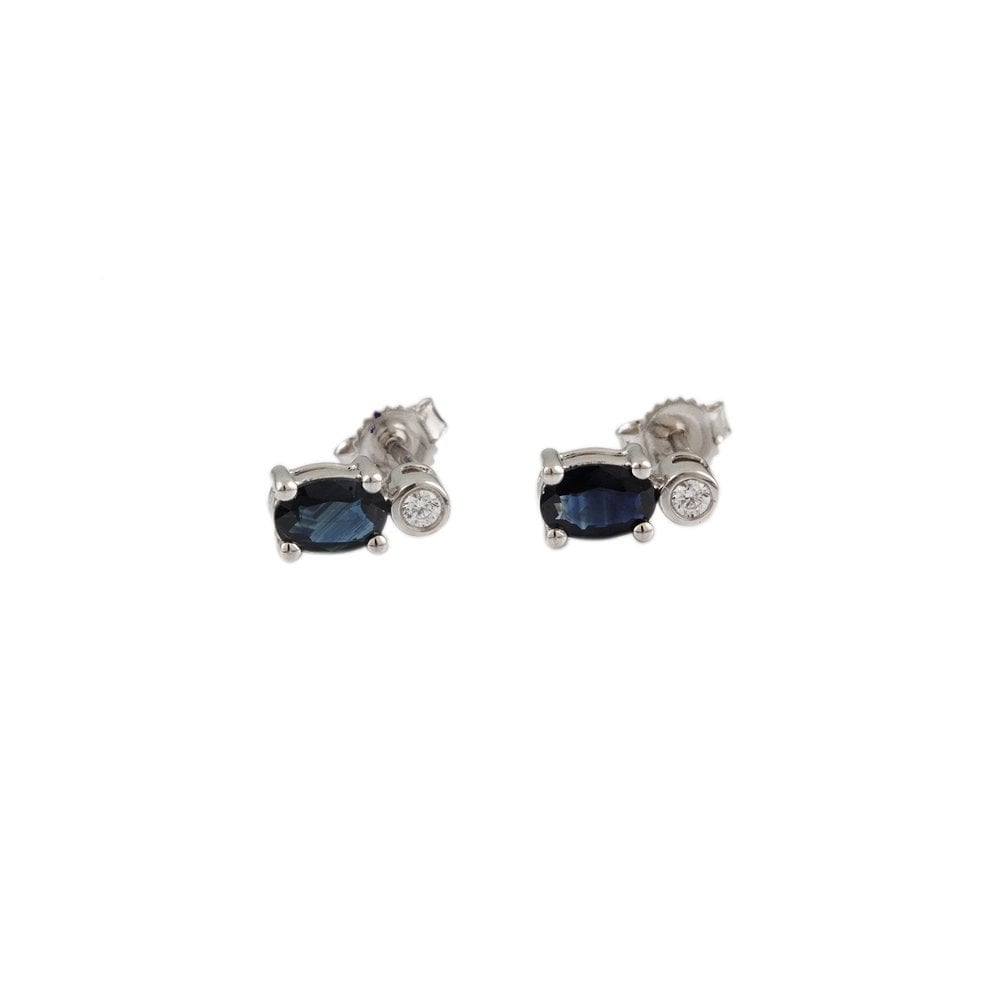White Gold 0.06ct Round Brilliant Cut Diamond and 1.20ct Oval Blue Sapphire Two Stone Stud Earrings