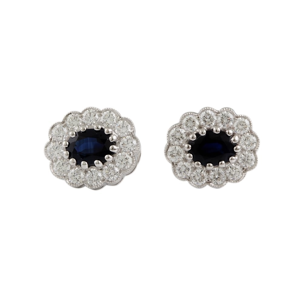 9ct white gold Sapphire and diamond cluster earrings.