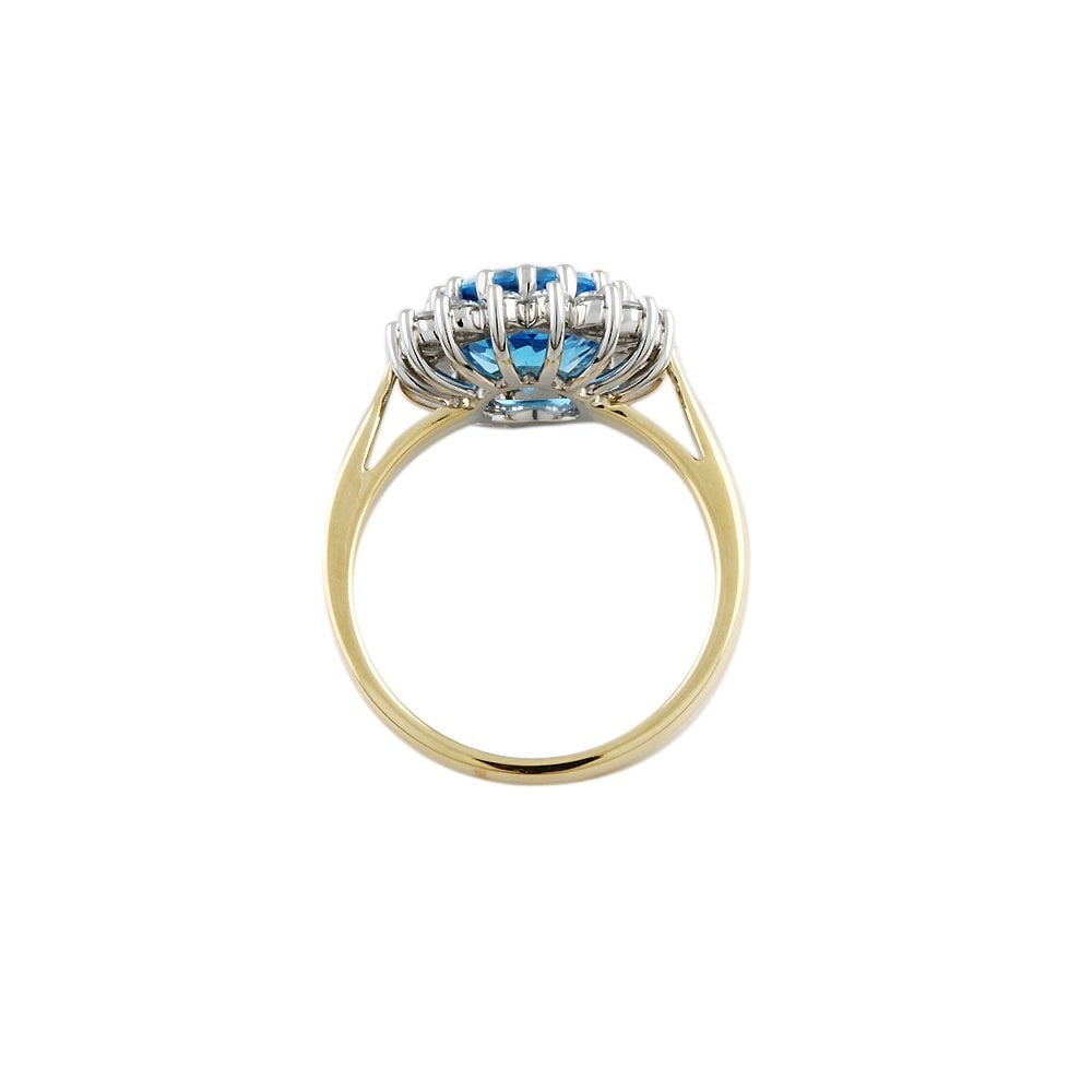 Yellow and White Gold 0.58ct Round Diamond and 4.00ct Oval Blue Topaz Set Cluster Ring