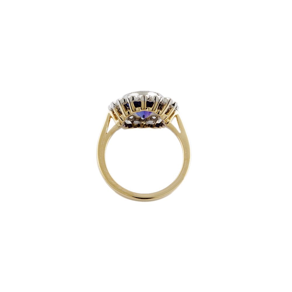 Yellow and White Gold 0.79ct Round Diamond and 3.70ct Oval Tanzanite Set Cluster Ring