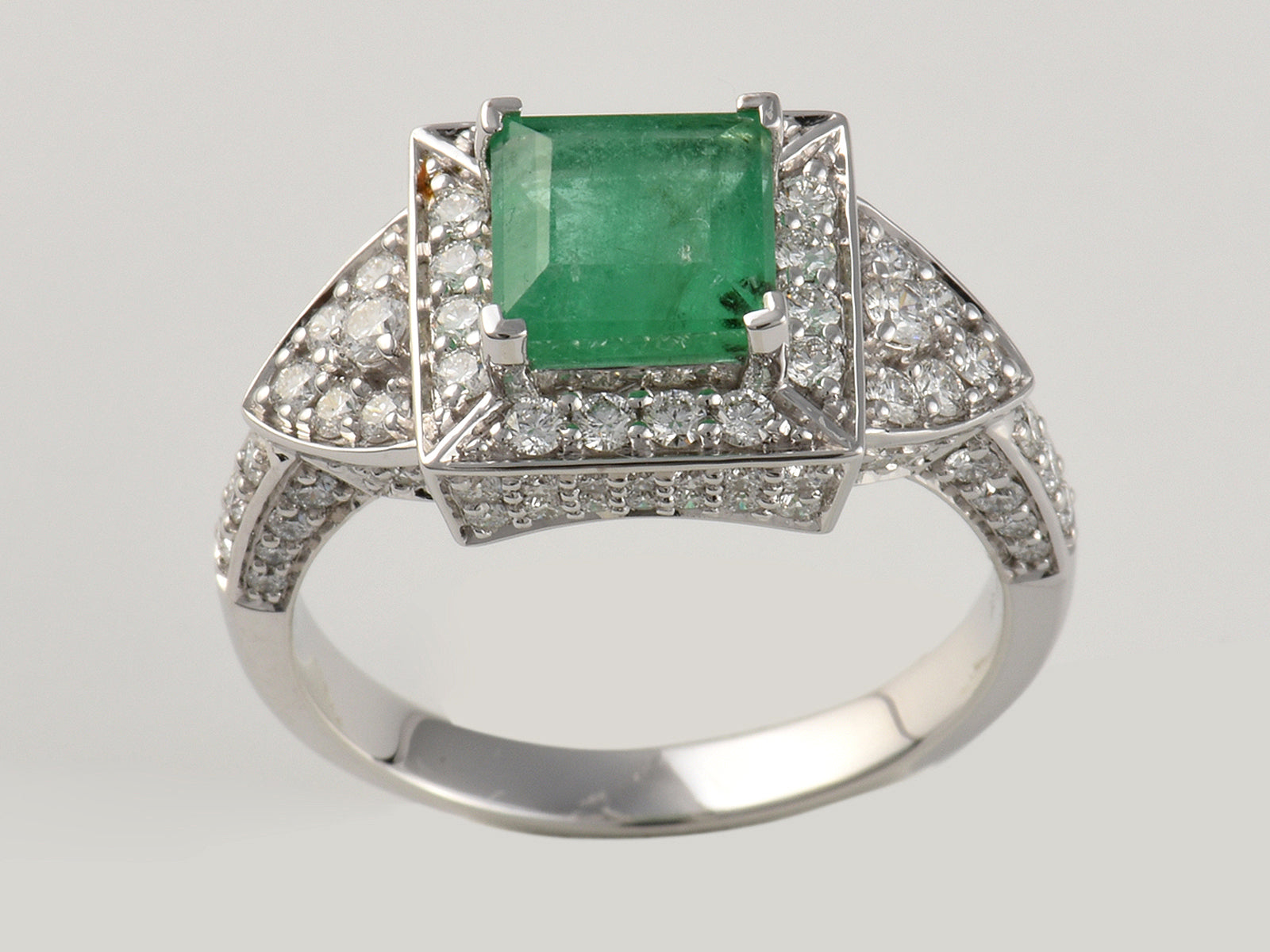 18ct White Gold, Claw Set, Emerald 1.75ct And Diamond 0.98ct Cluster Dress Ring