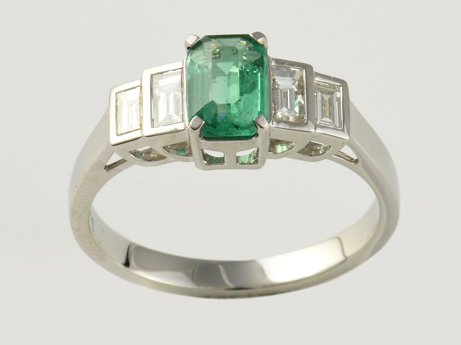 Platinum, Emerald 0.71 and Diamond 0.42ct Five Stone Ring.