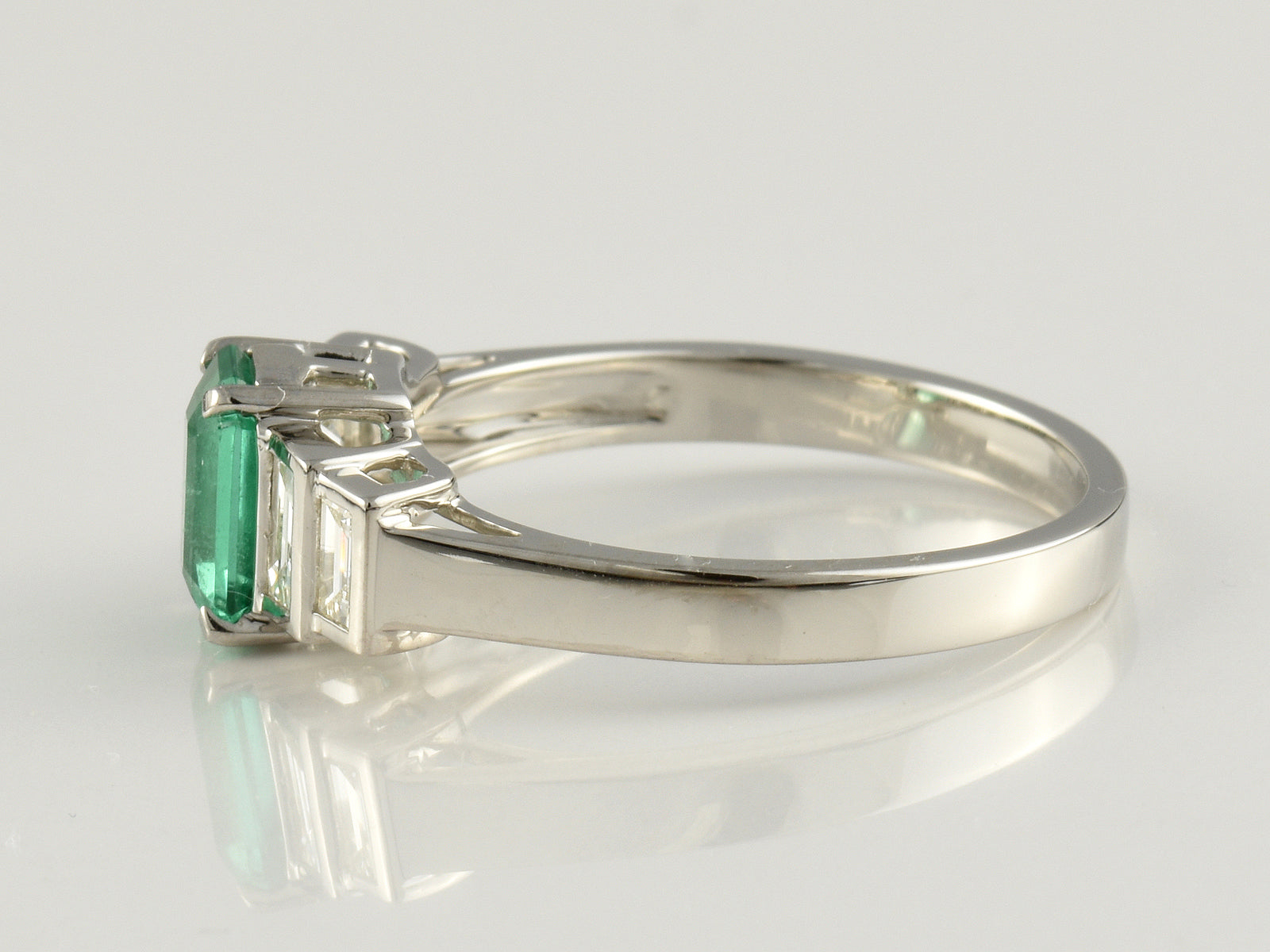 Platinum, Emerald 0.71 and Diamond 0.42ct Five Stone Ring.