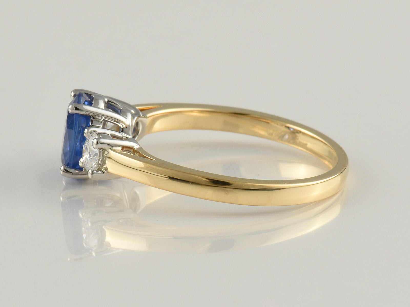 18ct Yellow gold, Platinum Claw Set, Sapphire 1.09ct And Diamond 0.31ct Three Stone Ring.