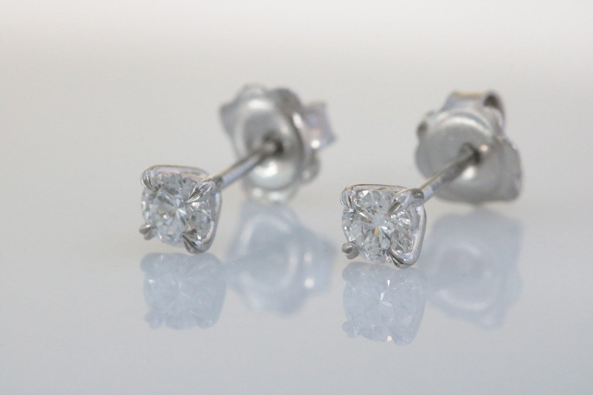 Platinum, Claw Set, GIA Certificated Diamond 0.61ct Solitaire Stud Earrings.