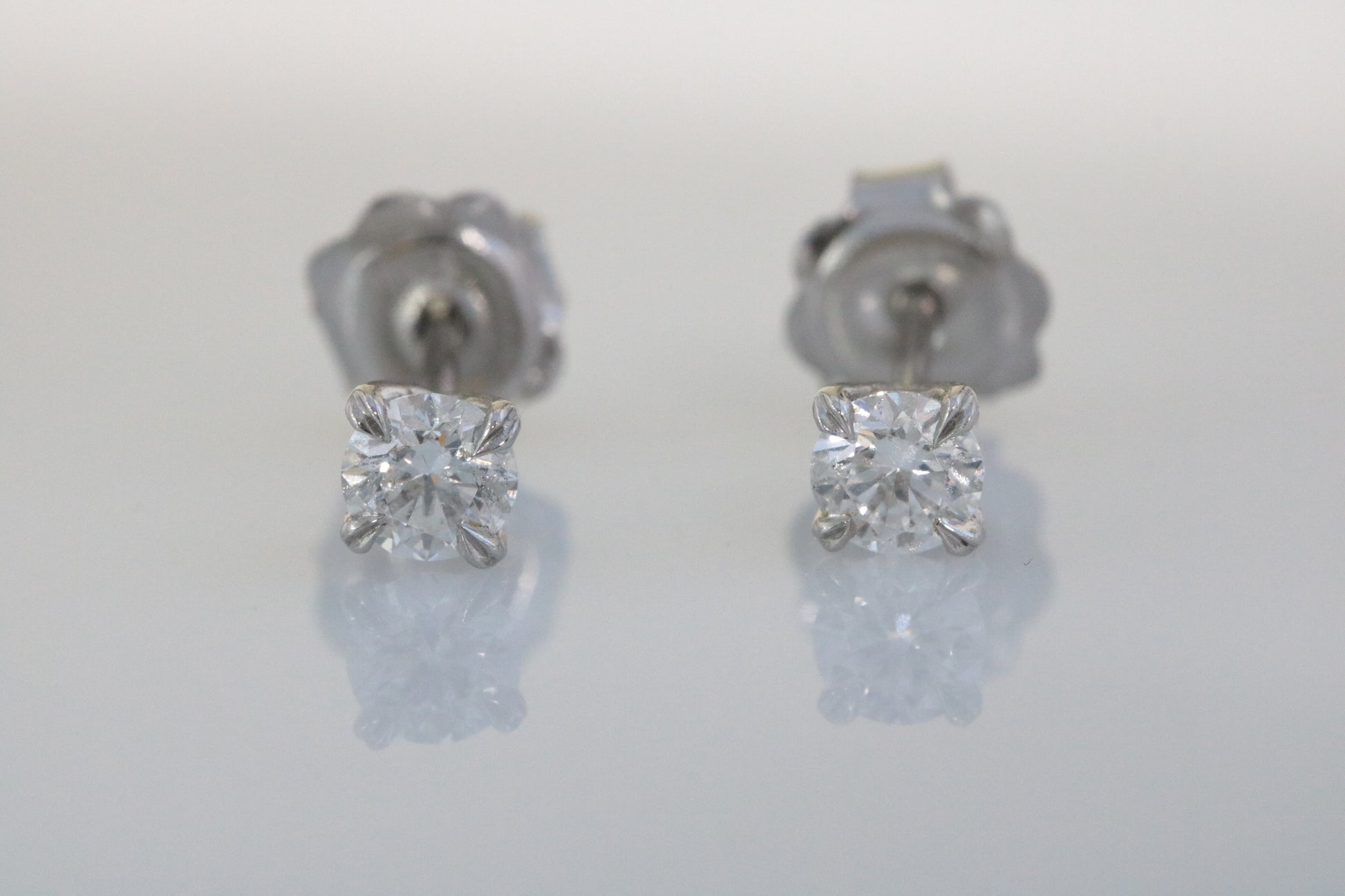 Platinum, Claw Set, GIA Certificated Diamond 0.61ct Solitaire Stud Earrings.