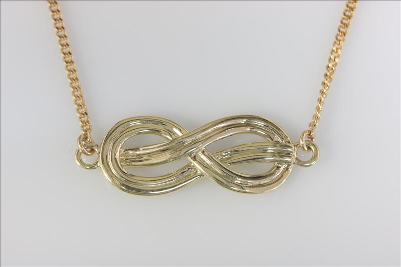 9ct yellow gold celtic style infinity knot pendant with 9ct yellow gold 16 inch curb chain